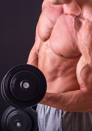 optimizing reps man holding dumbbells