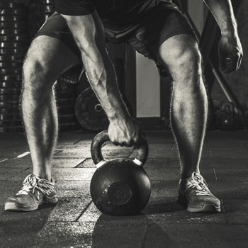 strength training benefits man with dumbbell